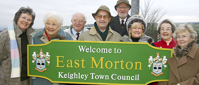 13-12-05Pictured with the new East Morton sign are, from left, Village Society members Mary Appleby (secretary), Doris Beanlands, Geoff Richardson, Cllr David Miller (chairman), Keighley Deputy Mayor Cllr Graham Mitchell, Cllr Nancy Holdsworth, Florence Bramall and Joan Sampson
